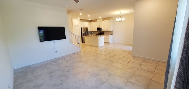 Building Photo - Beautiful townhome features a bright, open-concept layout