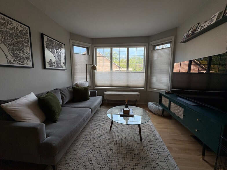 Living room with top down/bottom up cellular blinds. - 6337 Hillman Pl NE