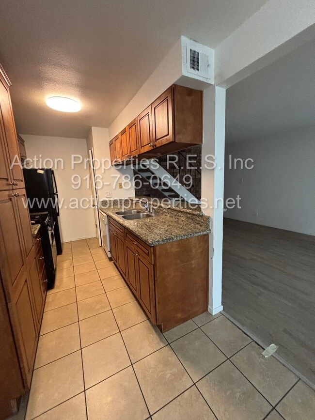 Building Photo - Action Properties RES Inc: offering Roseville Greens Condo 2 Story 2 Bedroom, Carport Parking Sha...