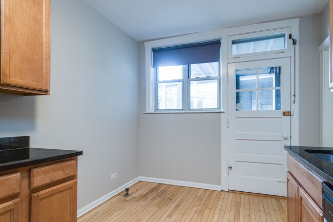 Eat in Area of Kitchen and Back Door to Deck with Transom Window - 603 Washington Blvd