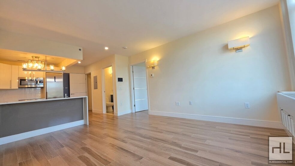 Building Photo - Sunlit 5th-Floor 1-Bed with a Showpiece Open Kitchen