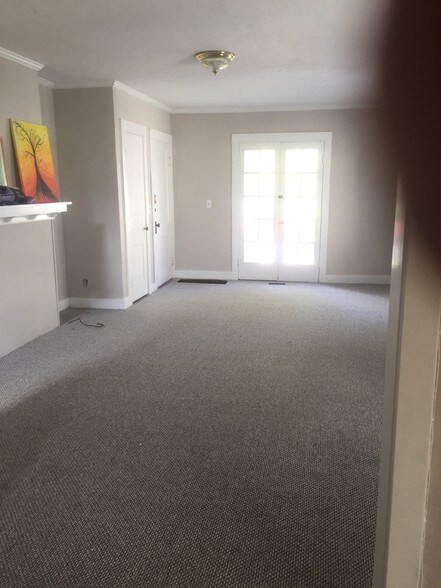 Living room with mantel and French Doors - 575 E Church St