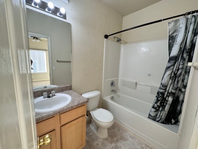 Building Photo - Home Near UNR: Spacious 4BR/4BA with Gated Access and Balcony!