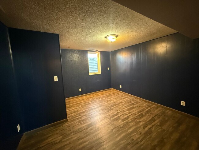 Building Photo - Spacious, four-bedroom, two-bathroom, coun...