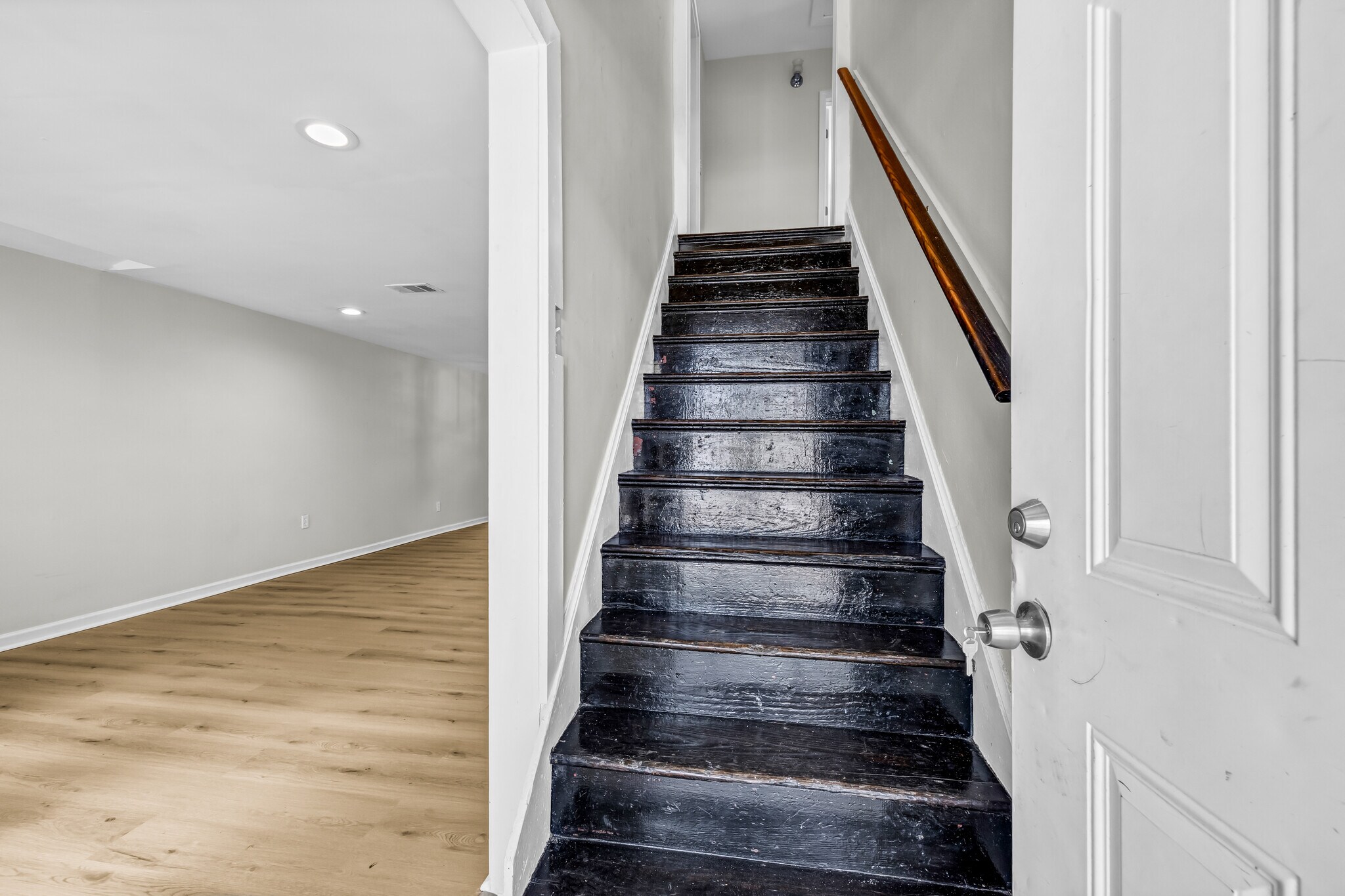 Upon entering, head up the original hardwood stairs, or into the living room. - 844 E 37th St