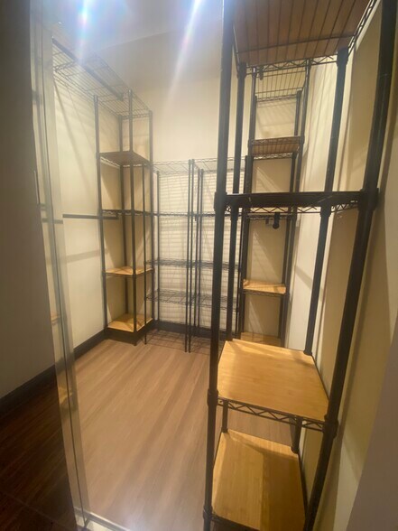walk in closet in bedroom - 8710 Delgany Ave