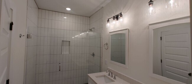 Building Photo - 5-bedroom home with 3 car garage and fully...