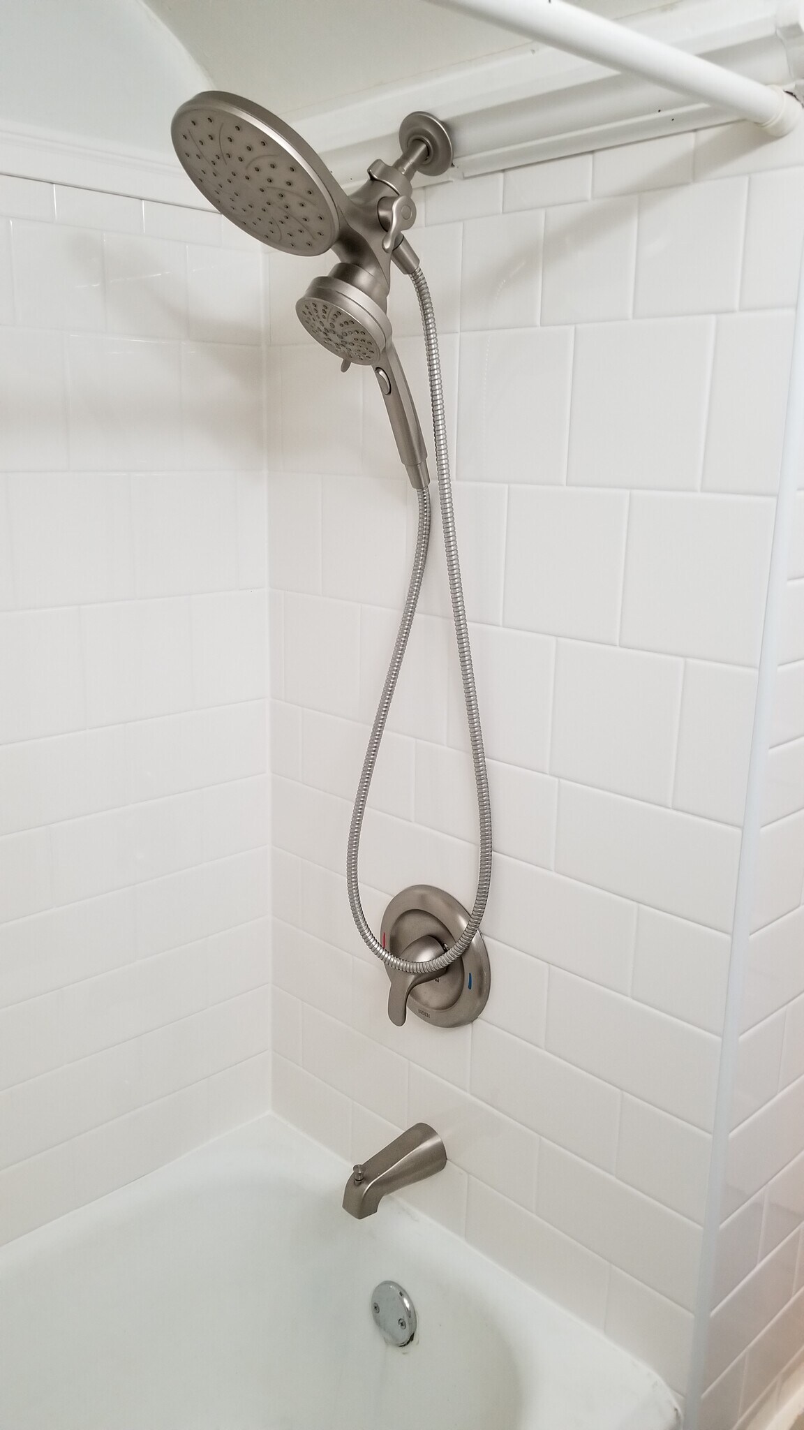 Updated shower tile and fixture - 304 Summit Ave
