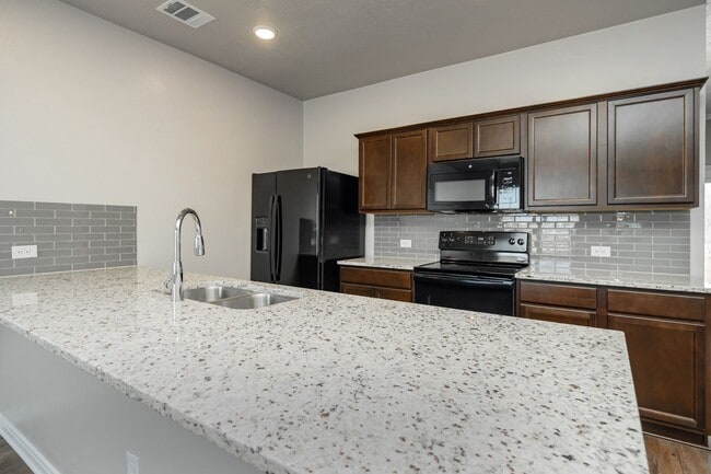 Building Photo - Spacious Townhome Available Now!