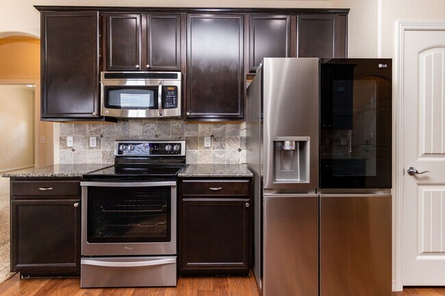 Building Photo - Spacious 5-Bedroom Home with Finished Base...