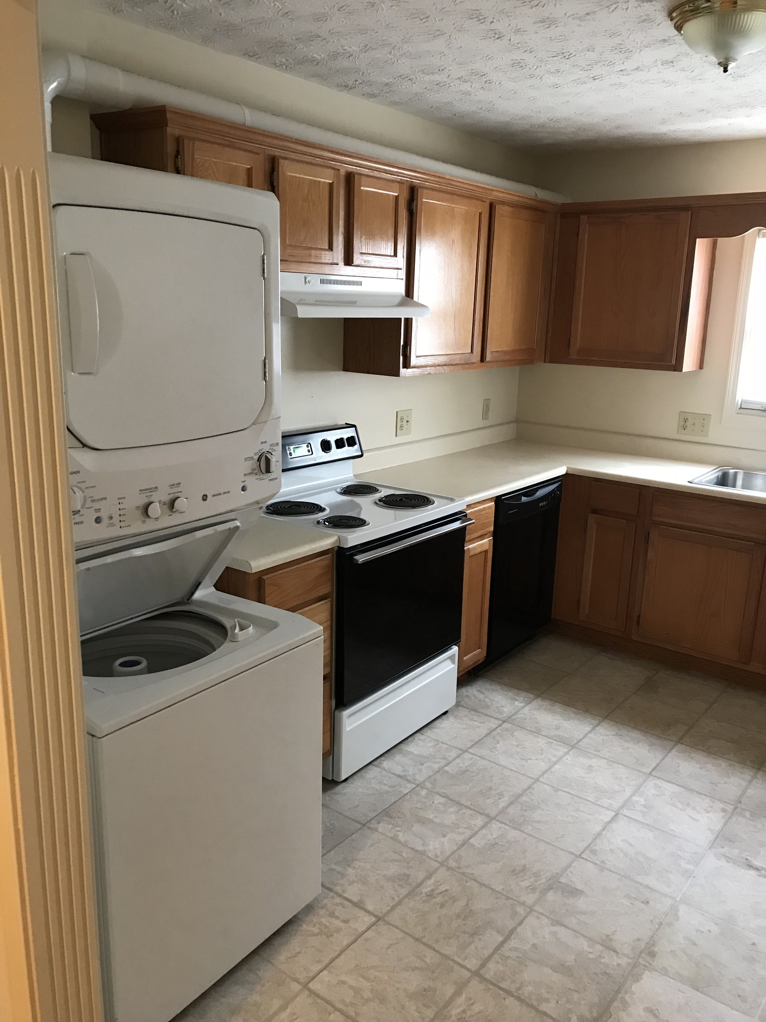 KITCHEN WITH STACK WASHER DRYER - 120 Middleground Way