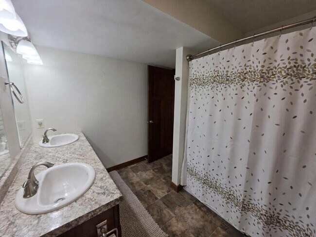 Building Photo - FREE SEPTEMBER RENT for this Spacious 4-Bedroom Home with Vaulted Ceilings with Finished Basement...