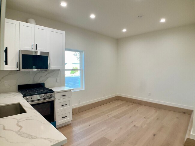 Building Photo - Lowered Price! FULLY Remodeled. BRIGHT! In-Unit W/D, Stainless Appliance Package, MODERN!