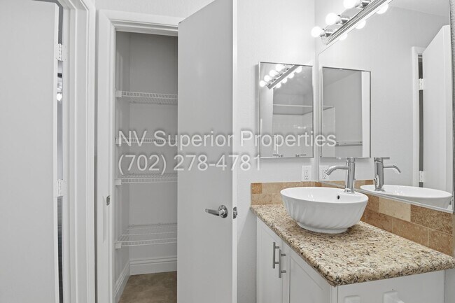 Building Photo - SW!!! 2 Bedroom Condo 1st Floor!! 2 Garage!! Gated!! Community Pool!! Fitness Room!! 2 Primary Be...