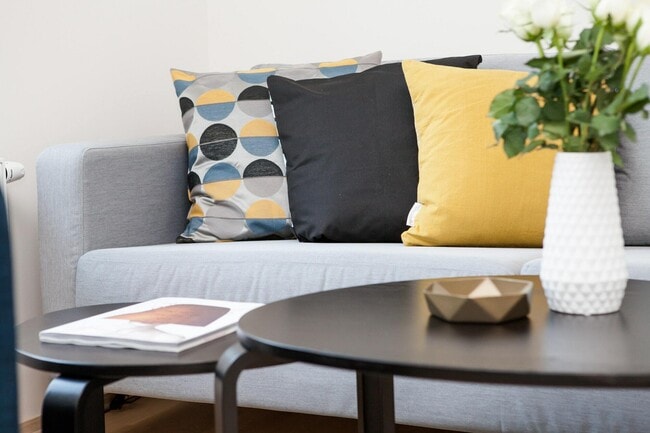 Experience the comfort and elegance of this chic living space, perfect for relaxation and entertaining. - Urban Peddler