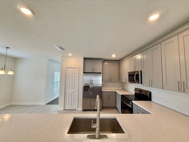 Building Photo - GORGEOUS, Large Completely Renovated Two-Story 4/2.5 PLUS LOFT in POINCIANA VILLAGES!
