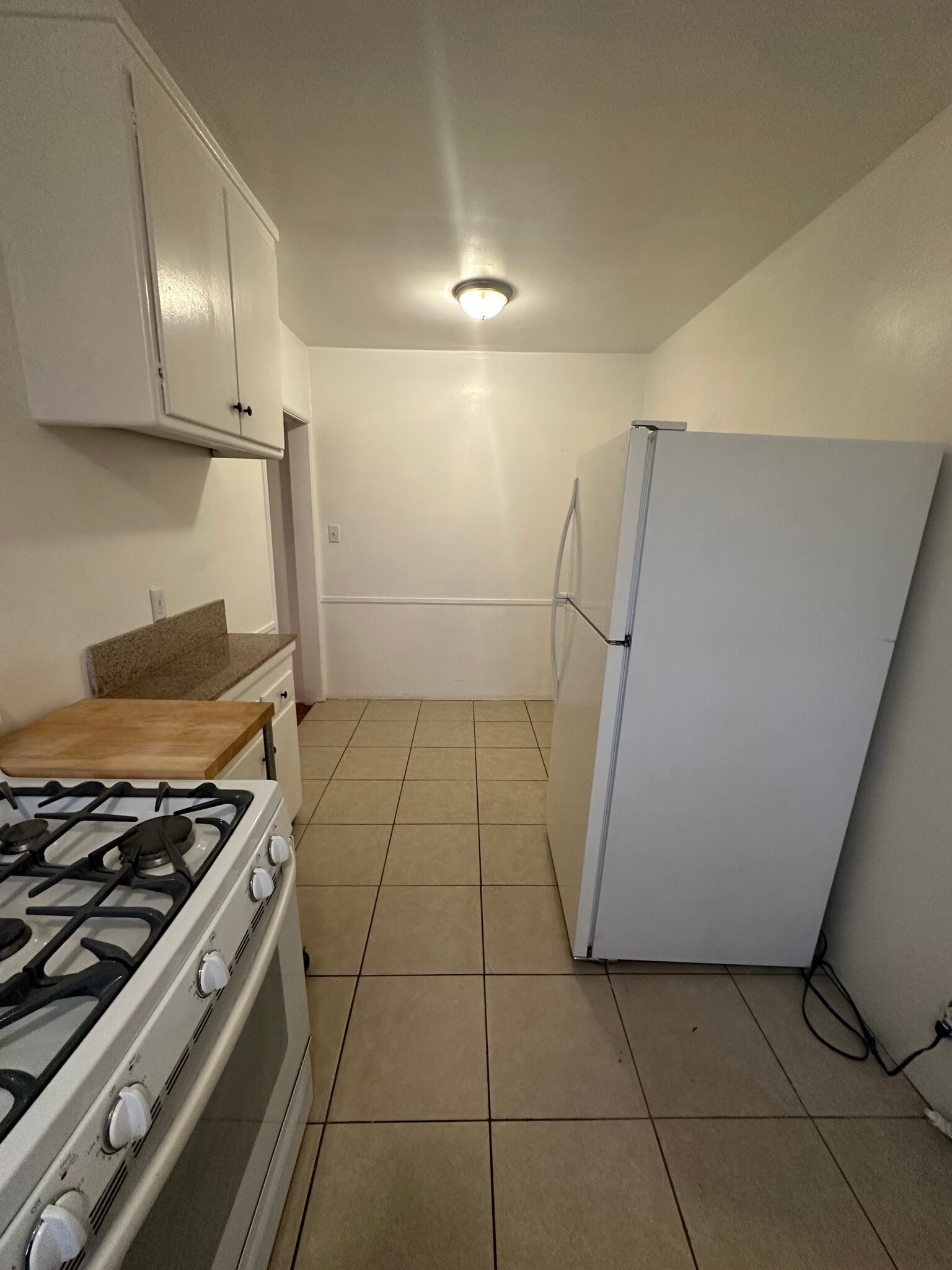 Stove and refrigerator in unit - 1444 S Ogden Dr