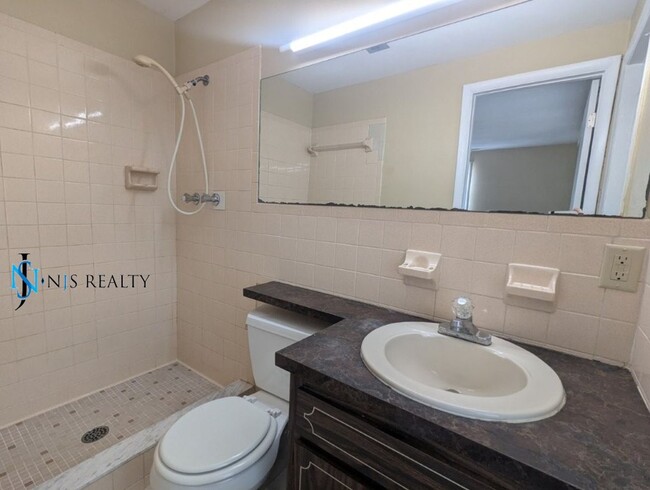Building Photo - Section 8 available: 2/2 over 1048sf with ...