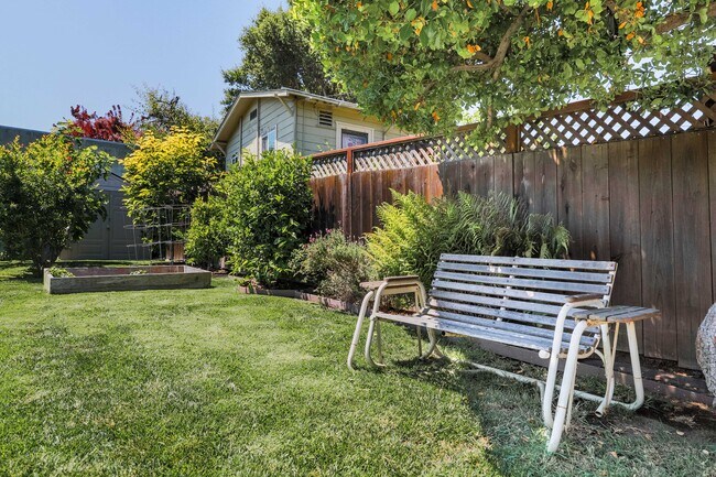 Spaciouls yard with fruit trees and garden. - 431 Athol Ave