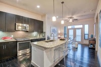 Building Photo - Making Midtown Buzz — Live in Style Today!