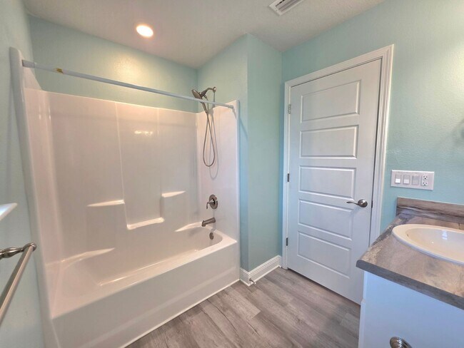 Building Photo - Bright, Open Layout | Screened Porch + Paver Patio | Move-In Ready