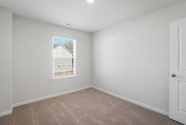 Building Photo - 4BR Home in The Pines at Paw Creek – New Construction + Private Deck