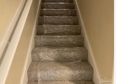 newly carpeted stair well - 201 Pensacola Beach Rd