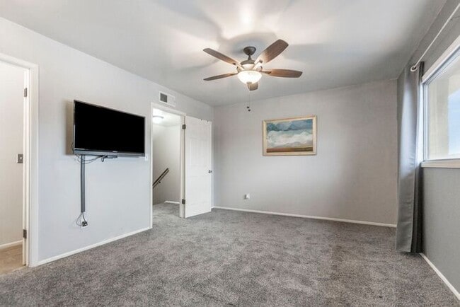 Building Photo - Discover this charming two-story townhome
