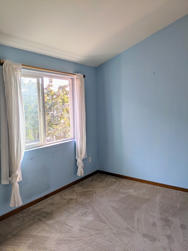 Second bedroom with large window and closet - 4810 S Holly St