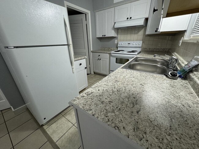 the laundry room is to the left, off of the kitchen - 4015 Tappan Dr