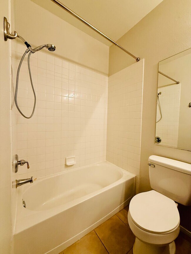 Building Photo - Immaculate and Inviting Two-Story Condo in...
