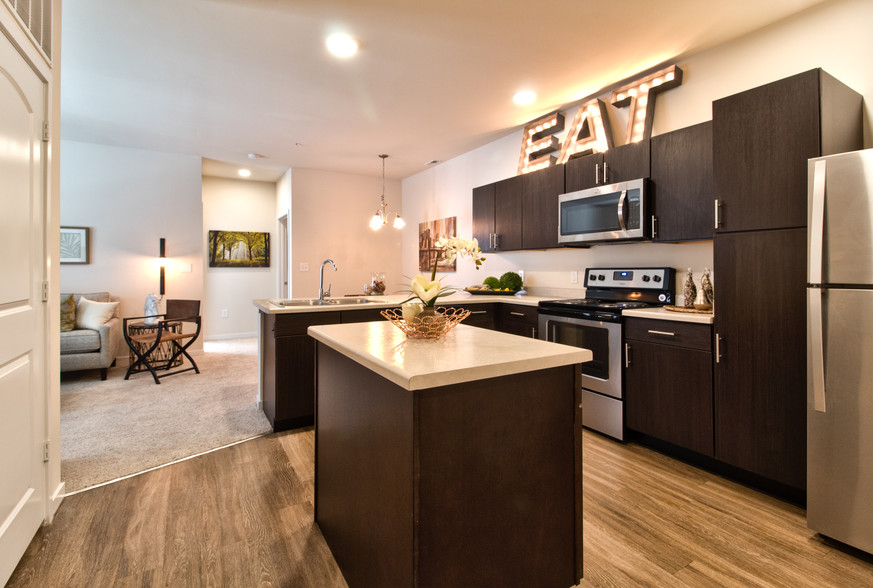 Spacious Kitchen with Island and Seperate Pantry - Aventura at Maryland Oaks