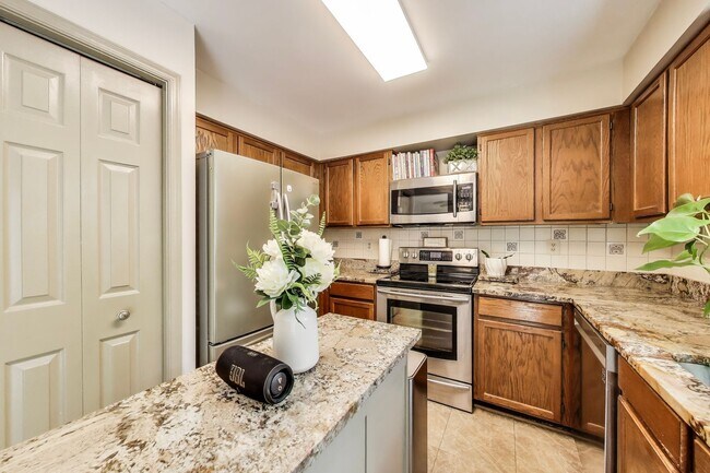 Building Photo - COMINGS SOON - Beautifully Updated Winchester-Built Townhome Backing to Serene Parkland.