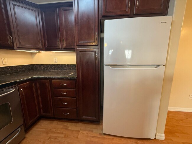 Building Photo - Upgraded Condo with Private Patio, AC, Pool, Gym, and Covered Parking in Gated Community