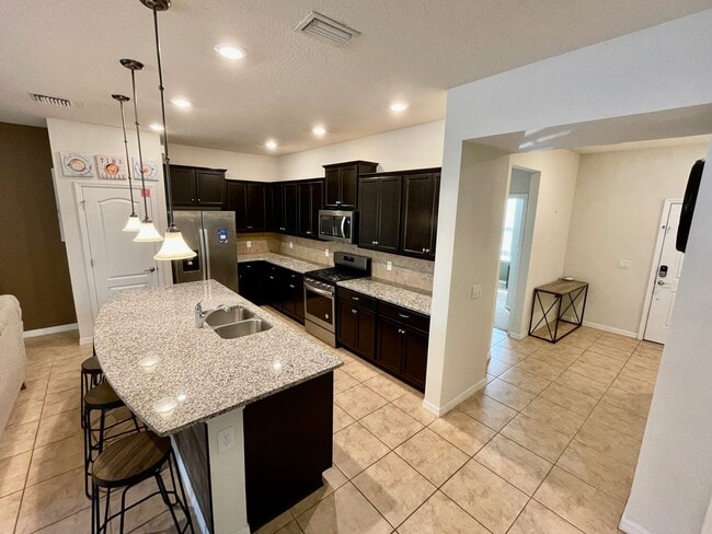 Building Photo - Spacious 5-Bed / 4.5-Bath Townhome w/ Private Pool & Sundeck in Gated Oakmont at Solterra Near Di...