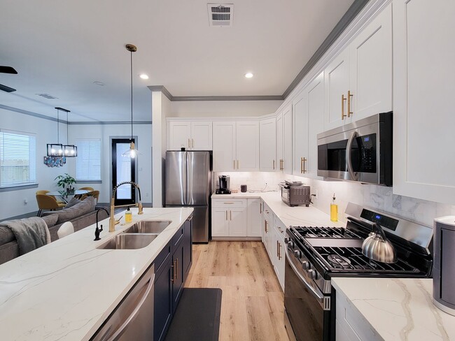 Building Photo - This 4-bedroom, 3-bathroom, two-story residence comes with a generous two-car attached garage. Re...