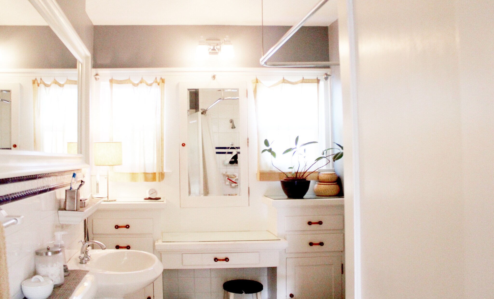 Period correct Bathroom. From hex tiles to deep cast iron soaker tub and incredible built in vanity. - 2635 NE 30th Ave