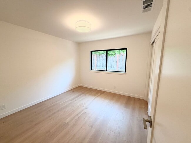 Building Photo - This premier 4-bed, 3-bath estate spans 2,565 sq. ft. on a 10,253 sq. ft. lot in North Los Altos.