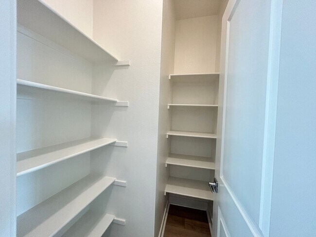 Building Photo - Gorgeous, 3 level townhome, featuring 2 car garage central Air, and in Unit laundry.