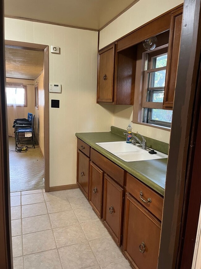 Building Photo - Clean 2 Bedroom home with hardwood flooring & large backyard