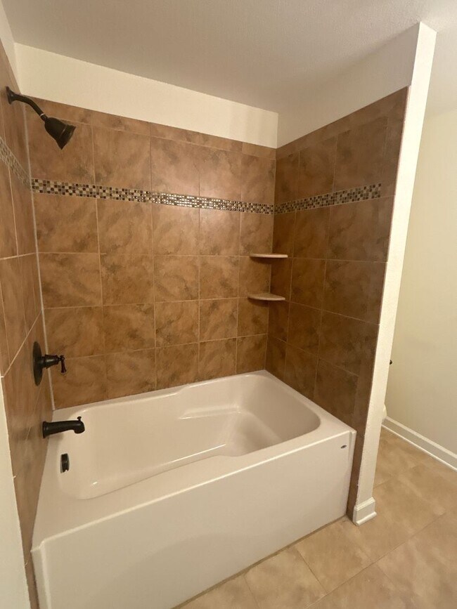 Building Photo - Spacious 4-Bedroom Home Near Base – No Tun...