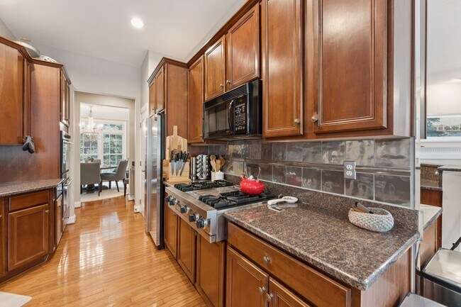 Building Photo - Discover this stunning four-level townhous...