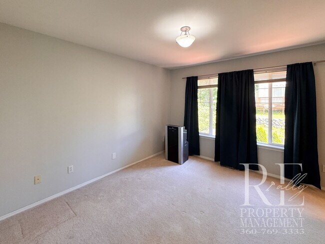 Building Photo - Dual Primary Suites, Huge Backyard Deck & Sun-Filled Living Spaces Near Everyday Conveniences