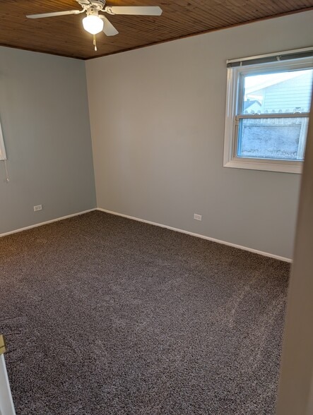 Bedroom 1, attached to 1/2 bath. NEW ceiling fan and new carpet! - 18531 W Judy Dr