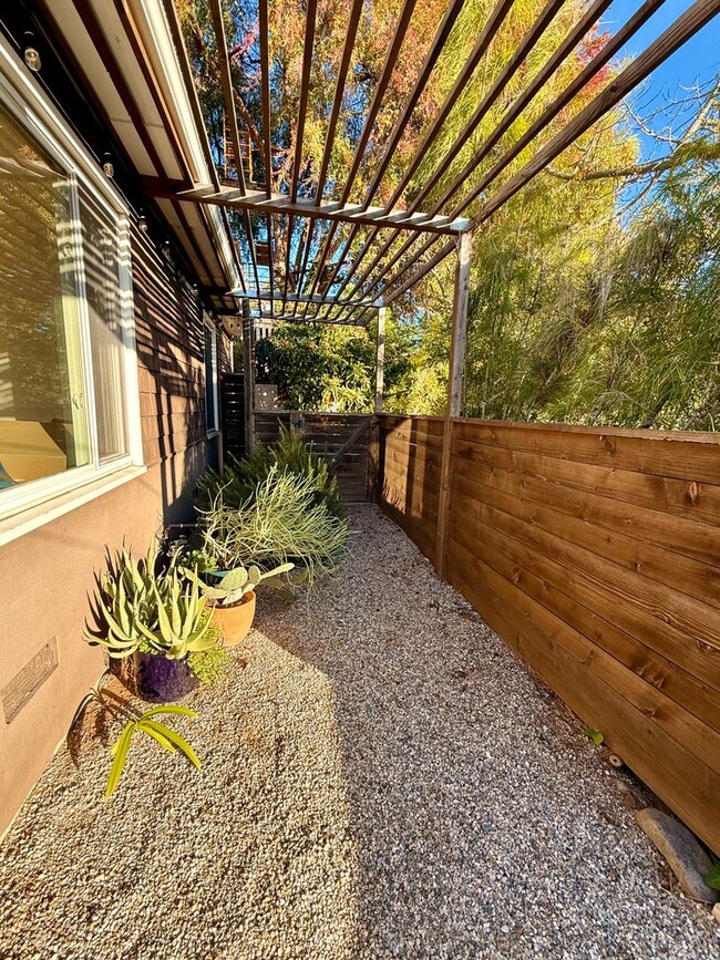 Building Photo - Hilltop Highland Park Sanctuary with Views, Private Gated Yard, In Unit Laundry, Parking & Abunda...
