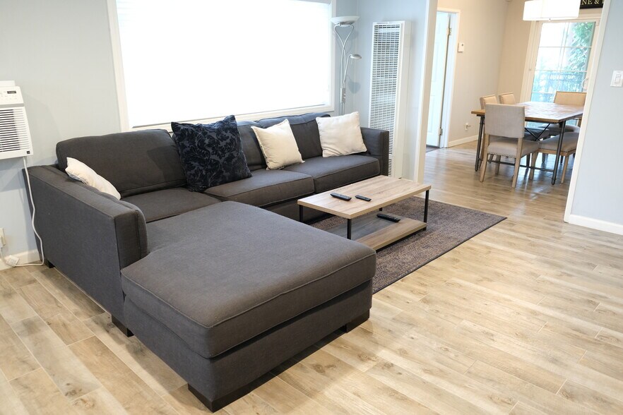 Huge sofa for multiple people to sit in the living room - 1243 N Alexandria Ave