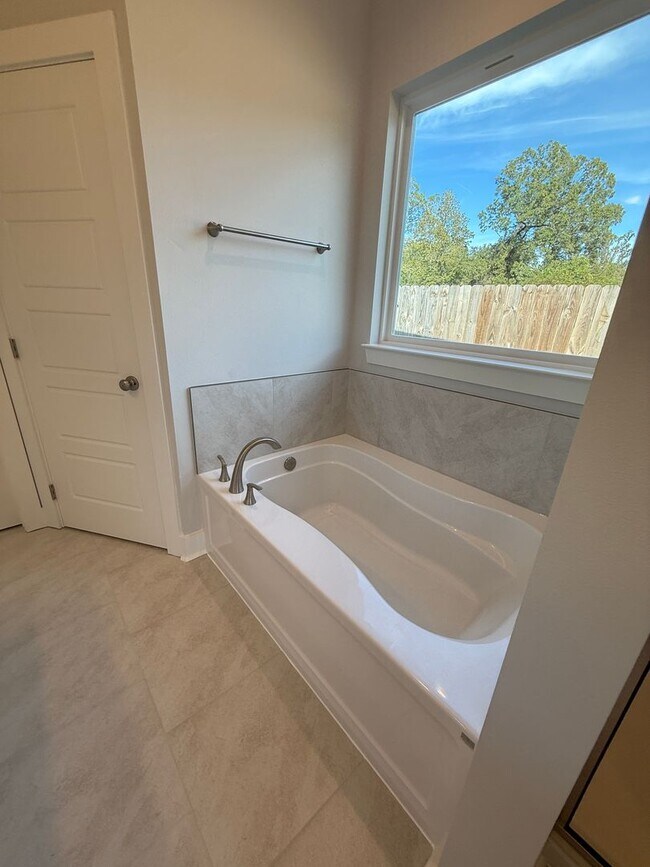 Building Photo - Must See! New 4/2 Home off Tiger Bend Rd. in Garden Hill Subdivision