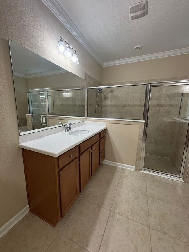 Building Photo - COMING SOON! Beautiful 4BR 3BA Home w/ Screened Lanai & Pond View • Garage Parking • Fenced Yard ...