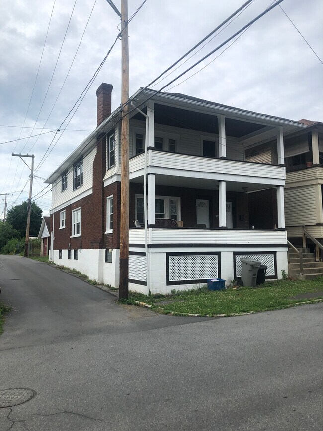 Apartment is entire second floor with stairs in front and back of building - 871 26th St