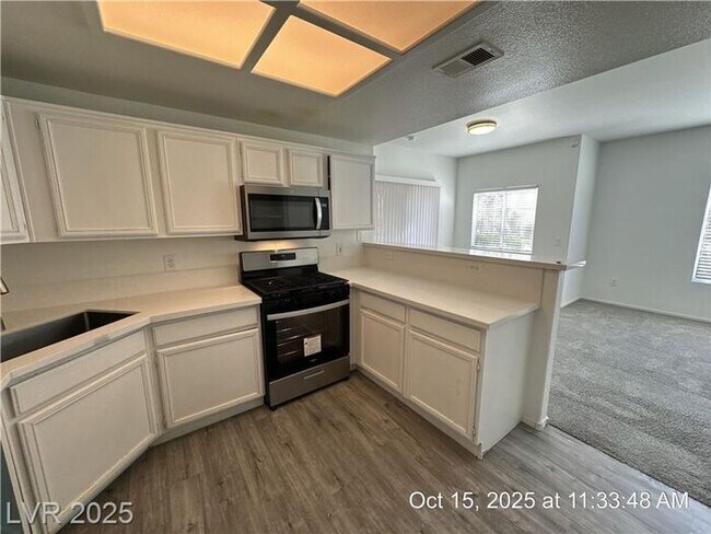 Building Photo - SPACIOUS FIRST-FLOOR CONDO LOCATED IN A GA...